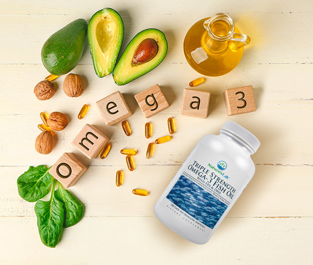 Nature's Lab Triple Strength Fish Oil on wooden background with omega-3 rich foods
