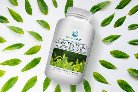 Nature's Lab Green Tea Extract supplement on white background with matcha green tea leaves