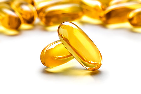 Fish oil soft gels on white background
