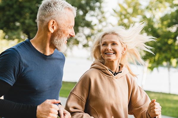 Mature couple jogging in the park