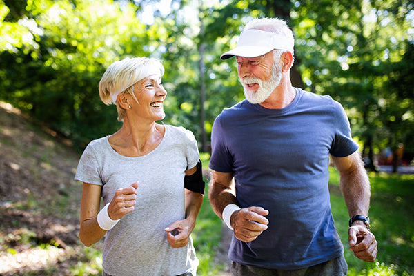 elderly couple exercising for stress relief