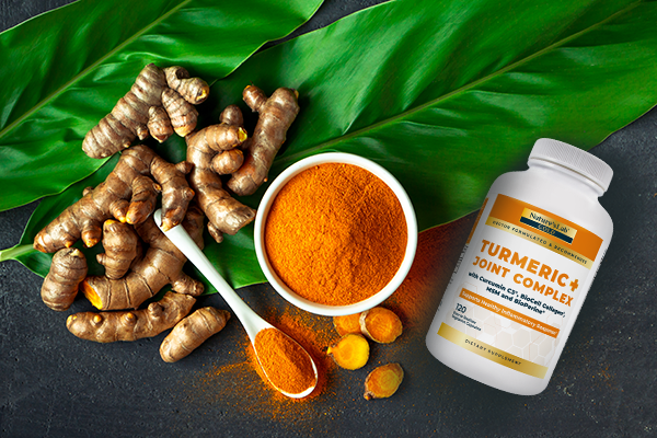 Turmeric + Joint Complex next to curcumin powder and turmeric root