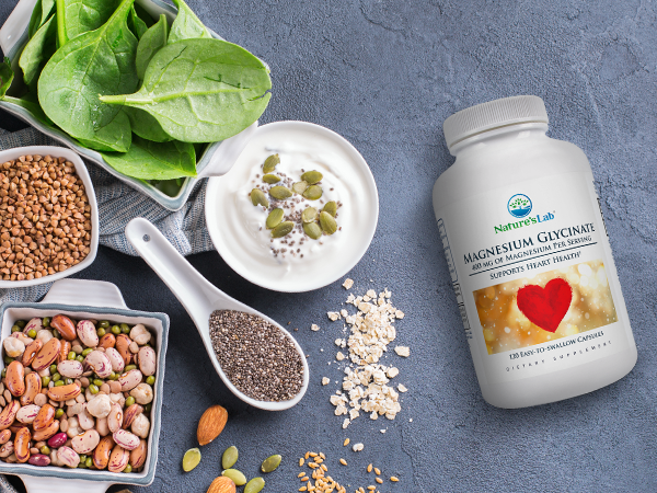 Nature's Lab Magnesium Glycinate on gray background with foods containing magnesium