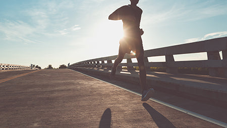 Man running on bridge
