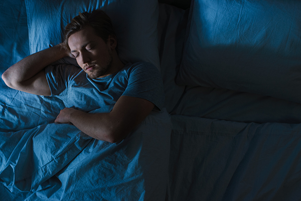Man sleeping in bed