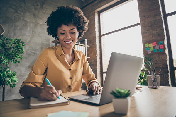 Woman working on laptop at a desk