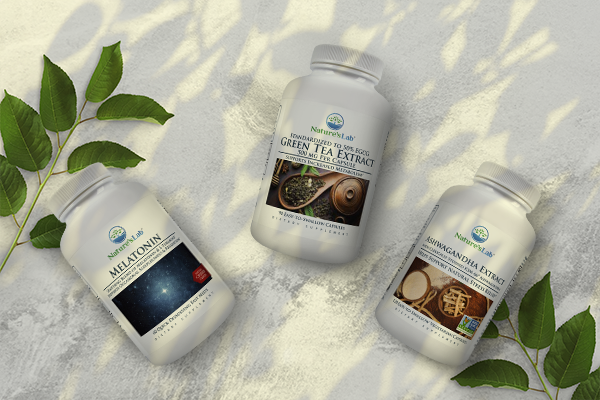 Melatonin, green tea and ashwagandha Supplements on stone background