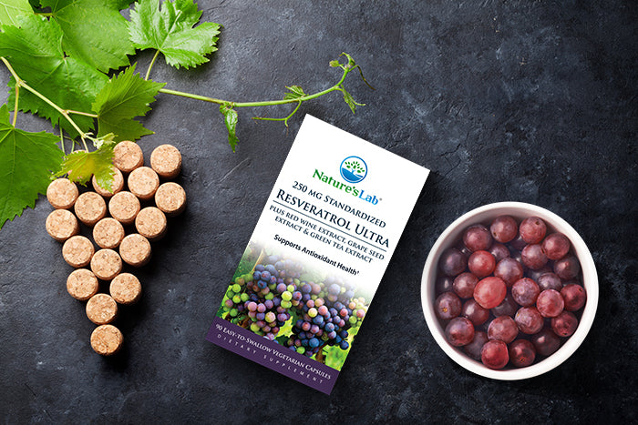 Nature's Lab Resveratrol Ultra next to a bowl of grapes