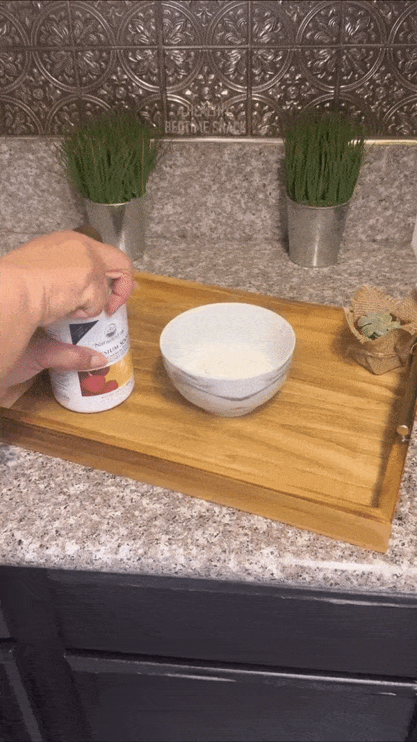 Mixing magnesium powder into yogurt with berries for a bedtime snack